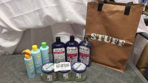 Bag of brand new haircare and bath products