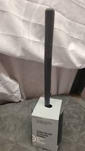 Target brand toilet brush and corner holder.