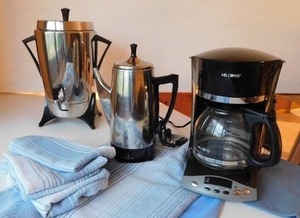 lot 62 image: Household Appliances Countertop Mr. Coffee 12 Cup Coffee Maker, Sunbeam Stainless Steel 30 Cup Brewer, Presto 10 Cup Electric Pot, Table Linen