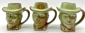 lot 62 image: Vintage Frankoma Pottery - Prairie Green Cowboy Mugs, Mini Boot Vase, Old Desert Gold Arrowhead Western Ashtray