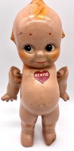 lot 109 image: KEWPIE DOLLS and KEWPIE Scootles Doll Art Book