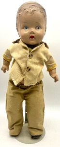 lot 117 image: Vintage Unmarked Fragile Boy Doll with Stand