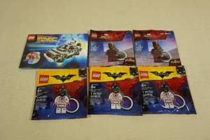lot 192 image: 5 Lego Keychains with Builders Book for Back to the Future Set