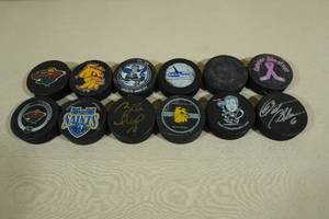 lot 196 image: 12 Hockey Pucks - 2 Signed
