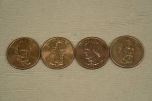 lot 203 image: 4 US Presidential Dollar Coins - Grant, Hayes, Johnson, Garfield