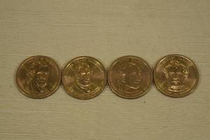 lot 205 image: 4 US Presidential Dollar Coins - Polk, Harrison, Tyler, Taylor