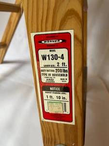 lot 204 image: Werner Two Step Wooden Ladder Model W-130-4