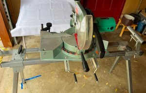 lot 29 image: Hitachi Ten Inch Compound Saw with Stand Model C10FC