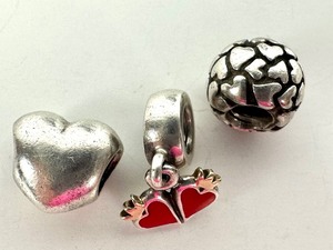 lot 430 image: Three Pandora Sterling Silver Heart Themed Charms