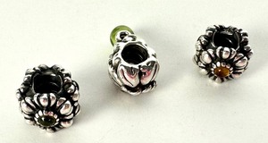 lot 424 image: Three Sterling Silver Pandora Charms