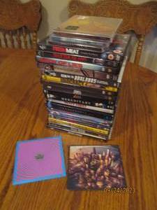 lot 89 image: Stack of action DVD movies and musi...