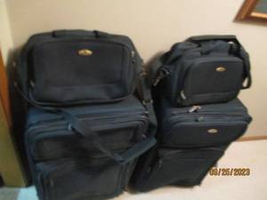 lot 143 image: 4-piece luggage set with two large ...