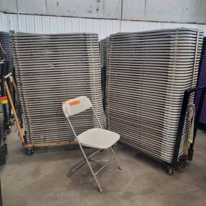 lot 64 image: (100) Bone folding chairs
