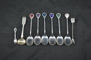 lot 116 image: Group of Silver Toned Collector Spoons, 900 Silver 2-Tine Fork, Miscellaneous Sterling Spoons