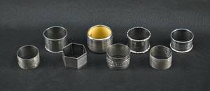 lot 115 image: Assortment of 8 Sterling Silver Napkin Rings