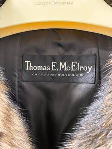 lot 361 image: Black & White Thomas E. McElroy Fur Coat with Leather Strings