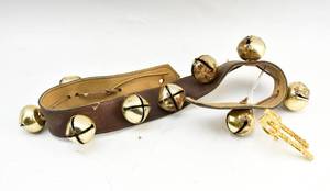 lot 147 image: 30 Leather Strap with Sleigh Bells and Charm