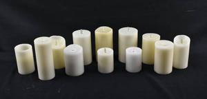 lot 214 image: Group of 12 White & Off-White Moving Flame Flameless Candles, Assorted Brands