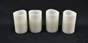 lot 218 image: Group of 4 White Flameless Pillar Candles
