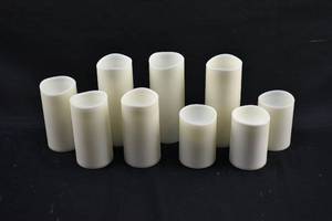 lot 220 image: Group of 9 White Flameless Pillar Candles, Various Brands