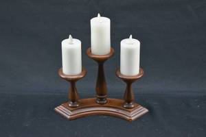 lot 223 image: Group of 3 White Moving Flame Flameless Candles on Wood Candelabra Style Stand
