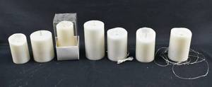 lot 226 image: Group of 7 White Moving Flame Flameless White Pillar Candles, Various Brands
