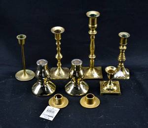lot 242 image: Group of 9 Gold Toned Metal Candle Holders