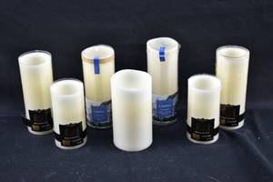 lot 279 image: 7 Ivory Flameless Pillar Candles