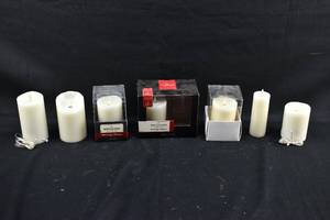 lot 282 image: 7 White Moving Flame Flameless Pillar Candles with Original Packaging