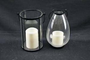 lot 287 image: 2 White Flameless Candles in Glass Lantern Style Holders