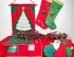 lot 43 image: Bin of Stockings, Linens, Advent Calendar, and Christmas Decor
