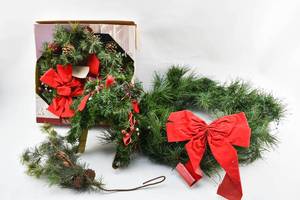 lot 208 image: Two Fake Pine Wreaths and Two Additional Decorative Pine Pieces