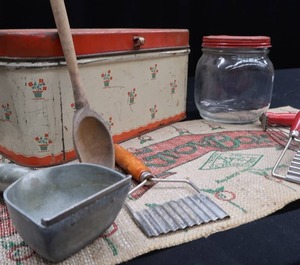 lot 36 image: VINTAGE BREAD BOX AND GLASS JAR IN RED