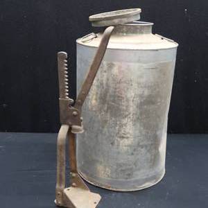 lot 38 image: LARGE METAL CAN WITH LID AND OLD BOTTLE CAPPER