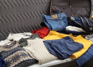 lot 101 image: SUITCASE FULL OF MENS CLOTHES