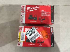 lot 175 image: LOT OF 2 - Milwaukee M12 12-Volt Lithium-Ion 4.0 Ah and 2.0 Ah Battery Packs and Charger Starter Kit