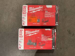 lot 176 image: LOT OF 2 - Milwaukee M12 12-Volt Lithium-Ion 4.0 Ah and 2.0 Ah Battery Packs and Charger Starter Kit