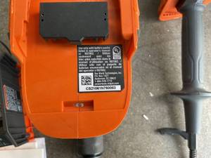lot 61 image: RIDGID 18V Brushless Cordless 2-Tool Combo Kit with Hammer Drill, Impact Driver, Charger, and Bag