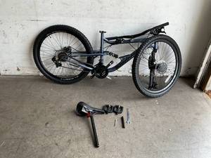 lot 67 image: Mongoose Status Slate Blue 21-Speed Mountain Bike with 26-Inch Wheels, Aluminum Frame, Dual Suspension and Disc Brakes