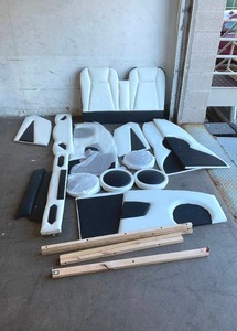 lot 96 image: LXBB Twin Size White Race Car-Shaped Platform Bed with Decorative Wheels and Seat Backrest