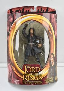 lot 32 image: LOTR Two Towers Helms Deep Aragorn with Sword Slashing Action Figure in Box