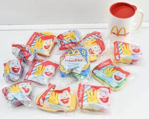 lot 116 image: Group of 12 Fisher-Price McDonalds Happy Meal Toys and McDonalds Mug