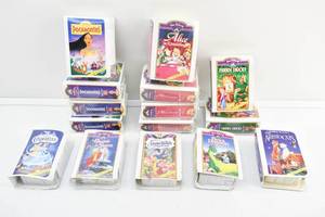 lot 114 image: Group of 15 Walt Disney Masterpiece Collection McDonalds Happy Meal Toys, Clamshell VHS Case