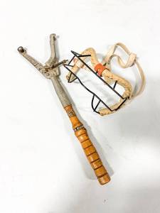 lot 122 image: Vintage Spalding Protective Mask and a Clay Pigeon Thrower