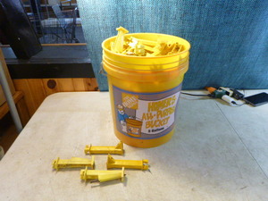 lot 26 image: Bucket Full of Wood Post Extended Insulators