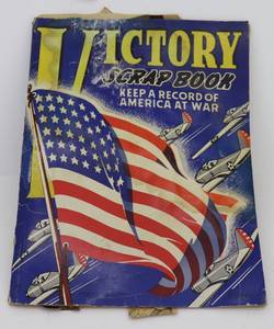 lot 89 image: Victory Scrapbook with numerous WWII Articles