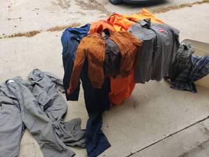 lot 114 image: Lot of Coveralls, Work Shirts, Orange Hunting Gear