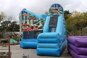 lot 937 image: Atlantis theme Bounce House and Slide with Tool King Air Eagle Blower and Stakes