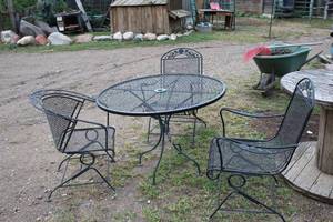 lot 989 image: MetalWrought Iron Patio Table Set - Umbrella Table and Three Chairs