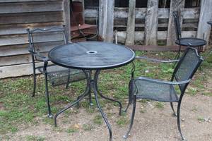 lot 995 image: MetalWrought Iron Patio Table Set - Umbrella Table and Two Chairs